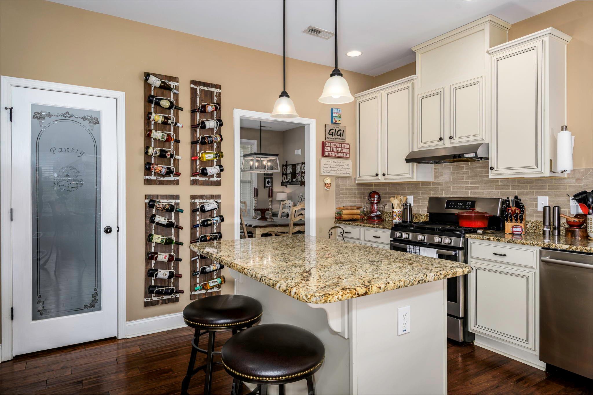 101 Ridge Top Drive Connelly Springs, NC 28612 - Photo 12 of 47 a kitchen with stainless steel appliances granite countertop a stove refrigerator and cabinets