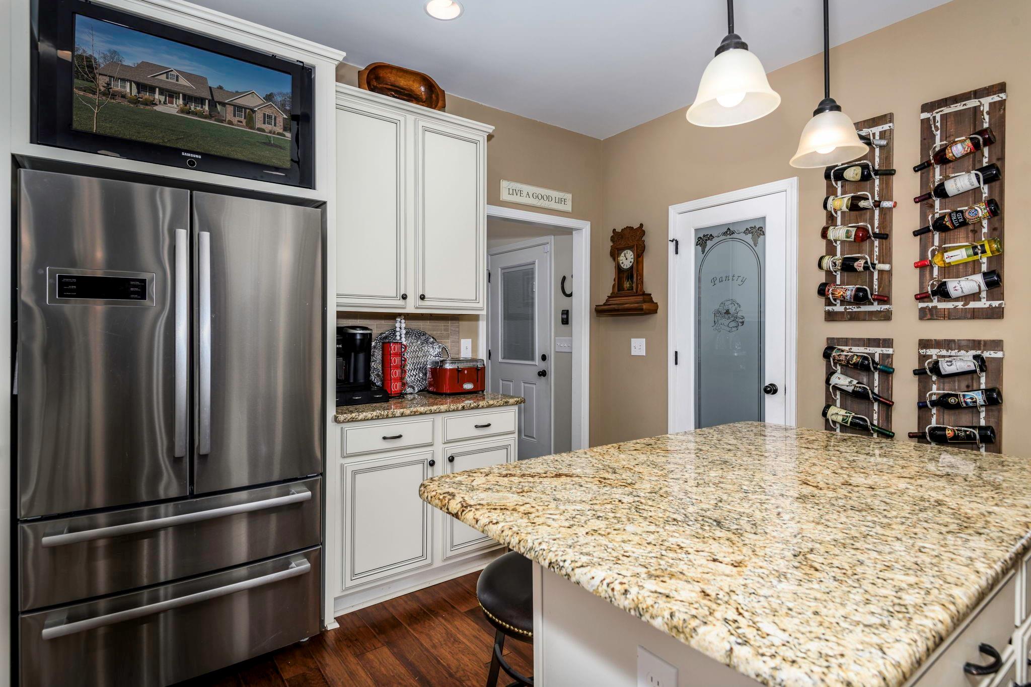 101 Ridge Top Drive Connelly Springs, NC 28612 - Photo 15 of 47 a kitchen with stainless steel appliances granite countertop a refrigerator and microwave