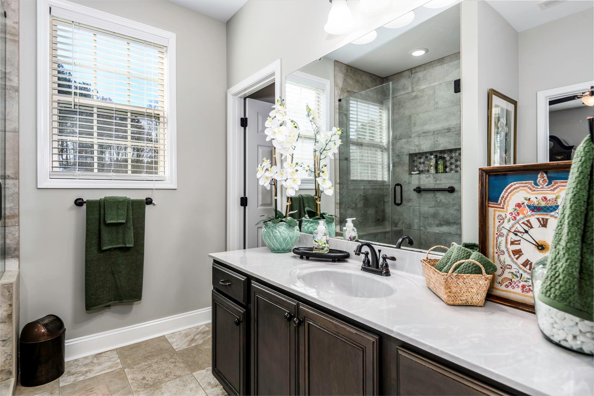 101 Ridge Top Drive Connelly Springs, NC 28612 - Photo 21 of 47 a bathroom with a sink a potted plant and a shower