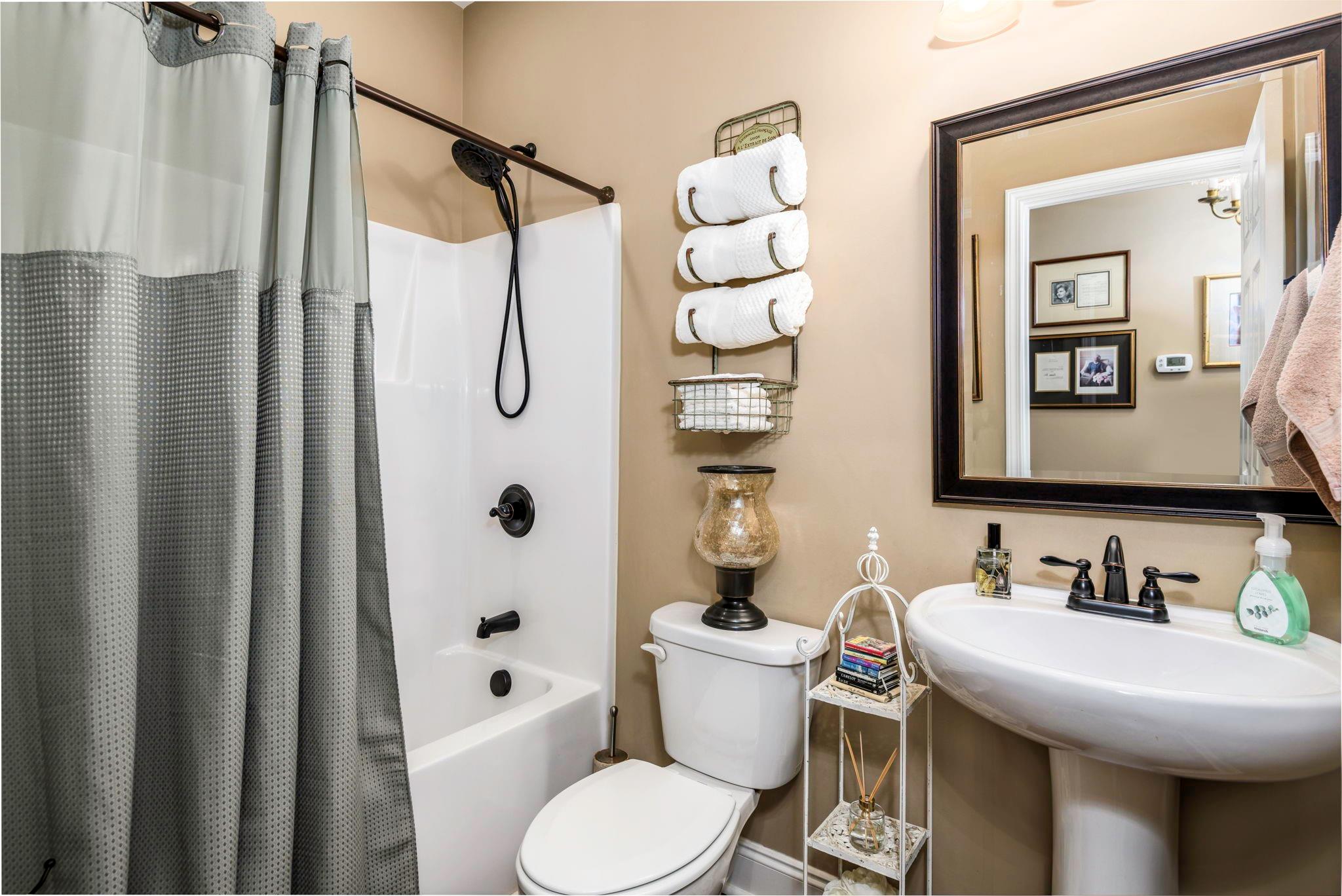 101 Ridge Top Drive Connelly Springs, NC 28612 - Photo 23 of 47 a bathroom with a sink toilet and shower