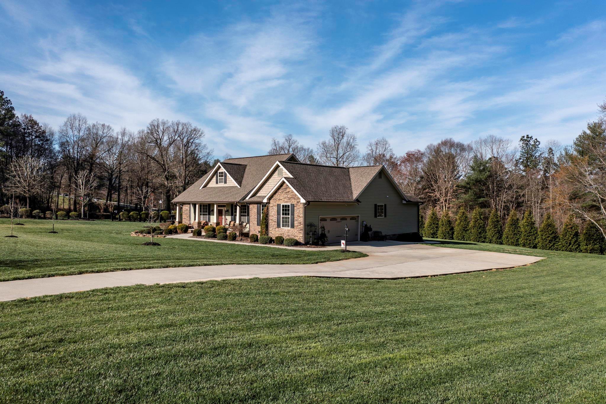 101 Ridge Top Drive Connelly Springs, NC 28612 - Photo 28 of 47 a front view of a house with a yard
