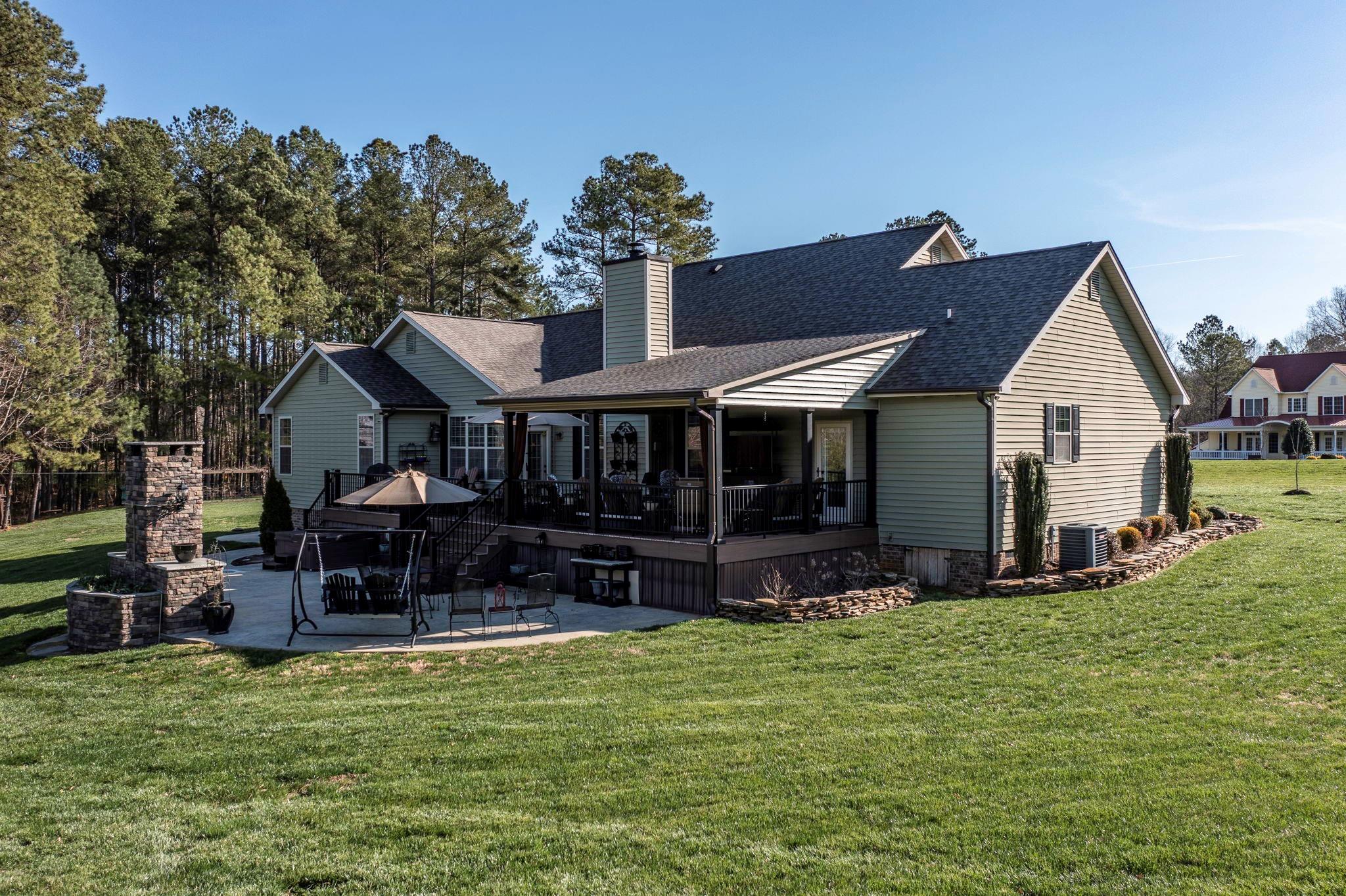 101 Ridge Top Drive Connelly Springs, NC 28612 - Photo 31 of 47 a view of house with outdoor seating and yard