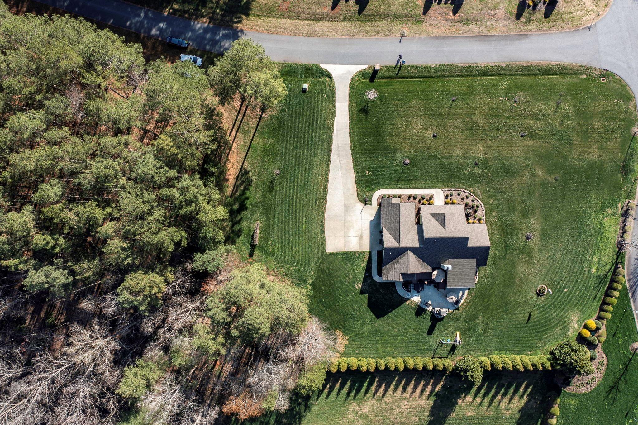 101 Ridge Top Drive Connelly Springs, NC 28612 - Photo 38 of 47 an aerial view of a house with a yard basket ball court and outdoor seating