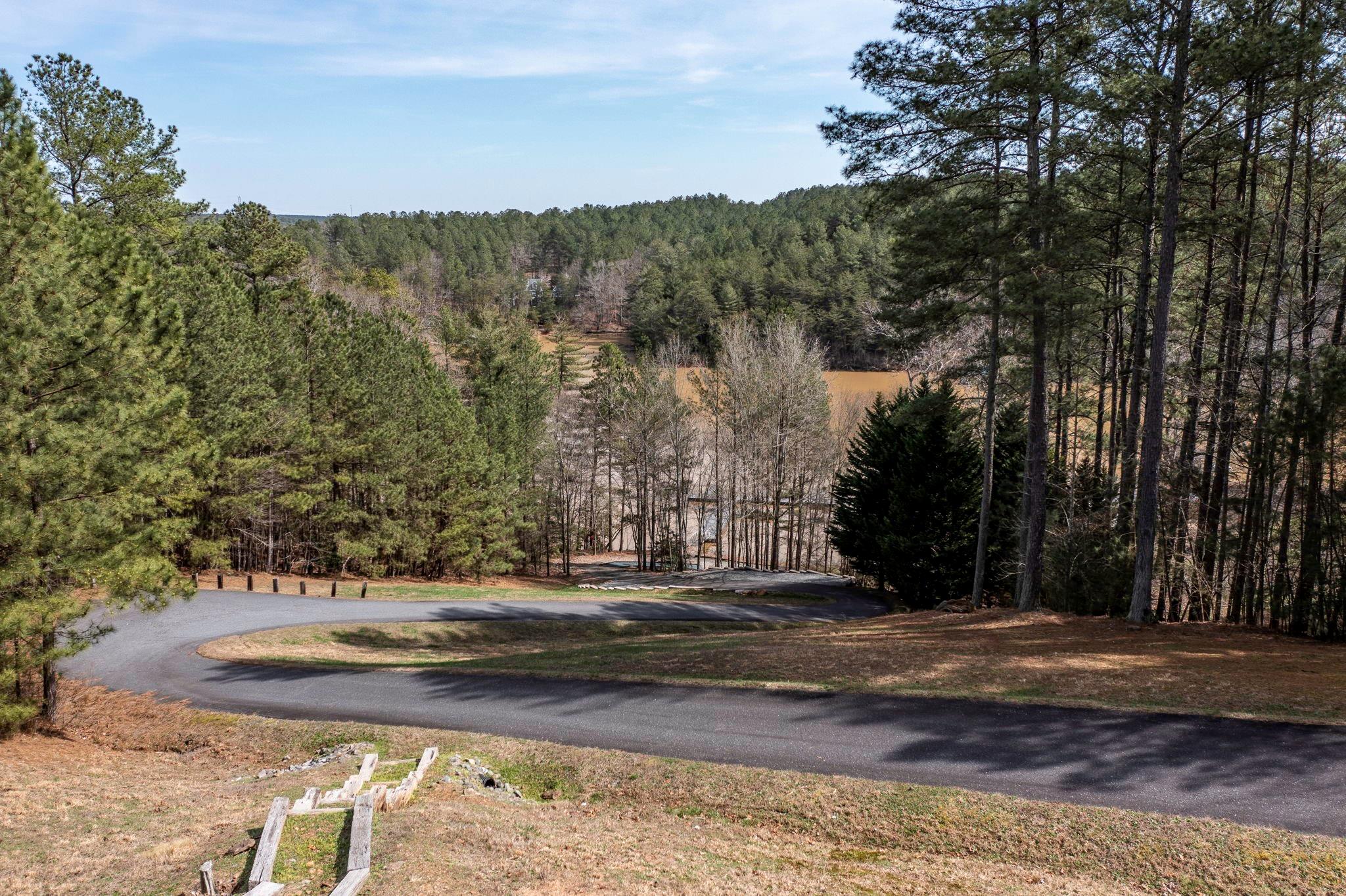 101 Ridge Top Drive Connelly Springs, NC 28612 - Photo 44 of 47 a view of a yard with large trees