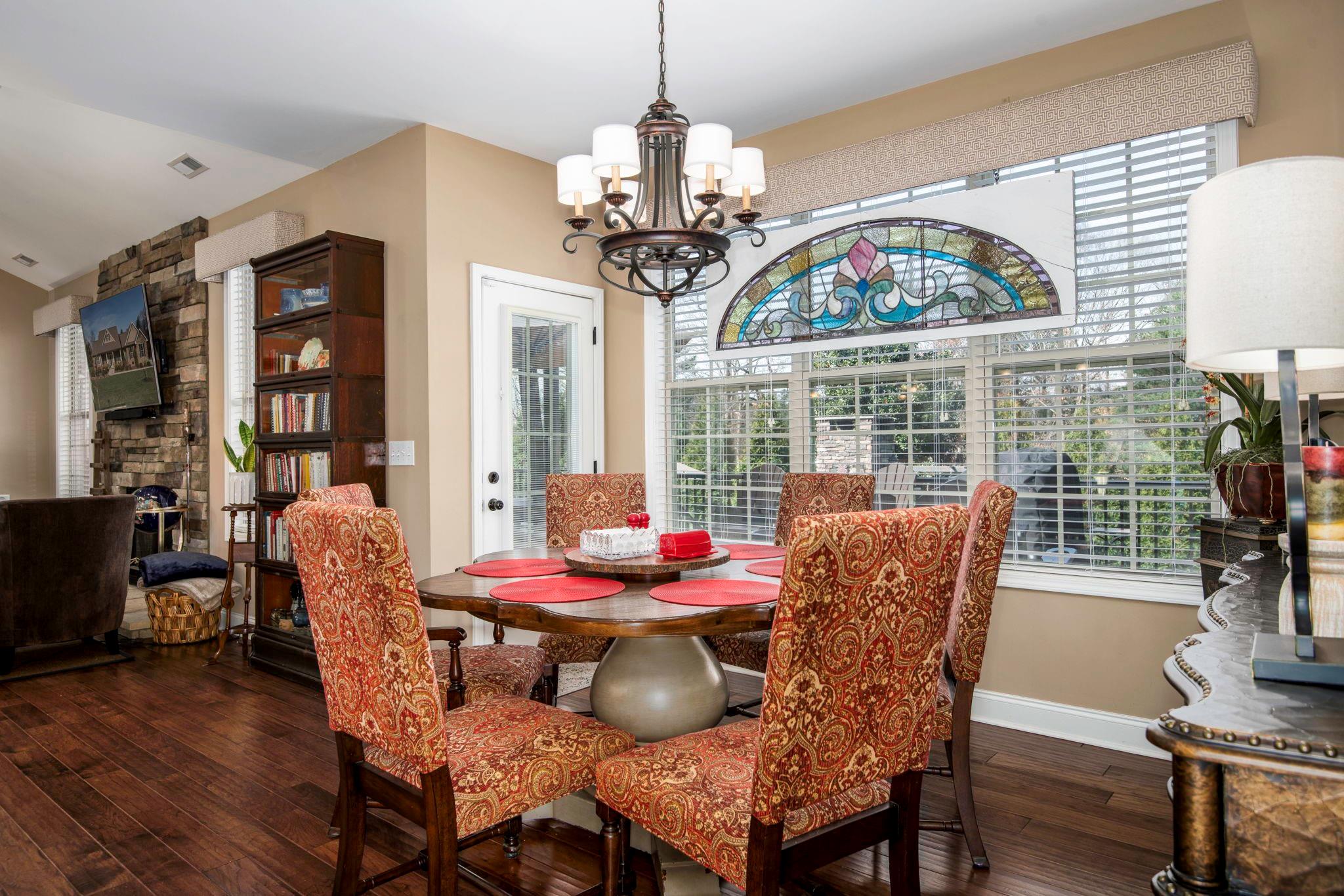 101 Ridge Top Drive Connelly Springs, NC 28612 - Photo 10 of 47 a dining room with furniture a chandelier and wooden floor