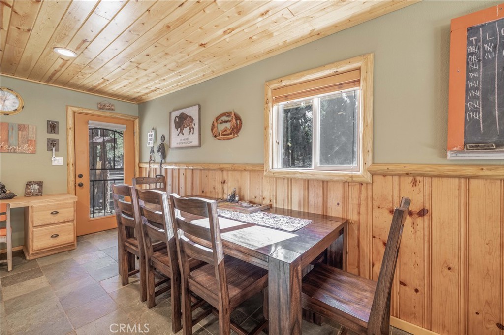 898 B Lane Big Bear City, CA 92314 - Photo 15 of 38 a view of a dining room with furniture and window