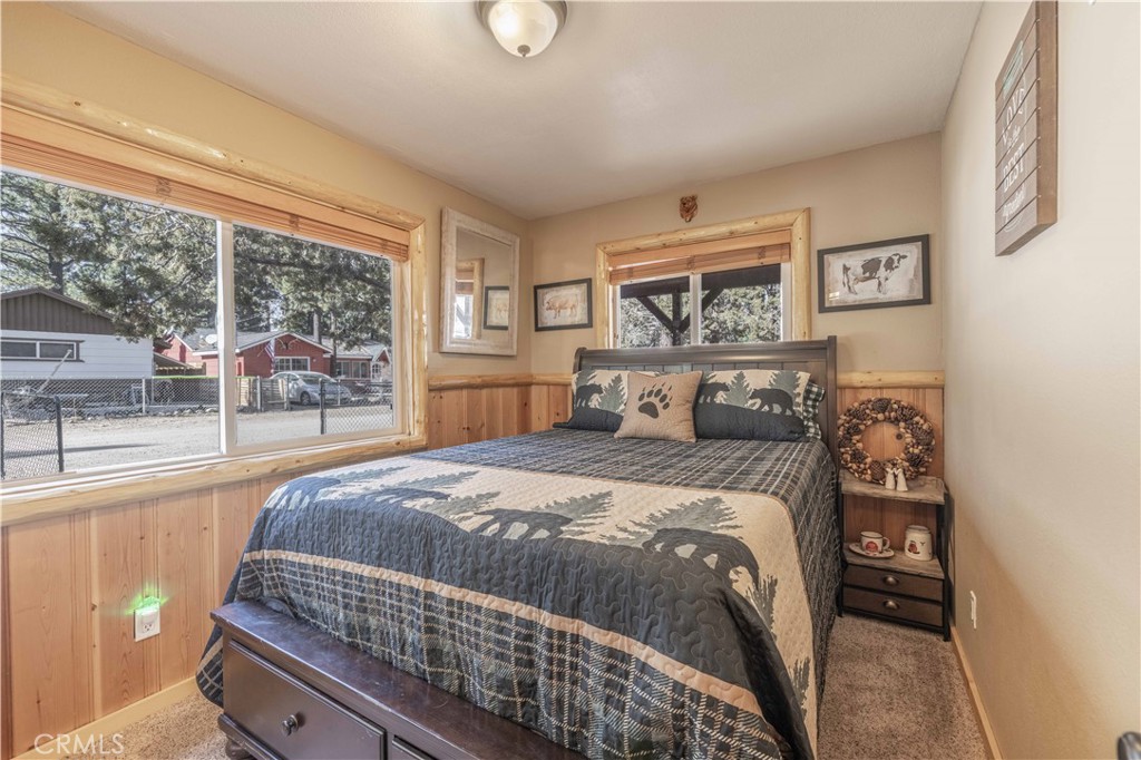 898 B Lane Big Bear City, CA 92314 - Photo 18 of 38 a bed sitting in a bedroom next to a window