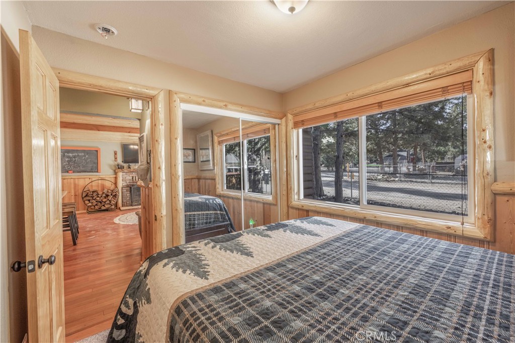 898 B Lane Big Bear City, CA 92314 - Photo 20 of 38 a bedroom with a large bed and a large window
