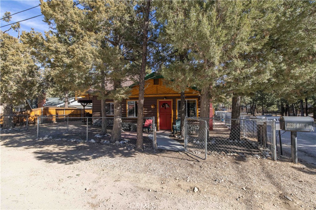 898 B Lane Big Bear City, CA 92314 - Photo 27 of 38 a front view of a house with a yard