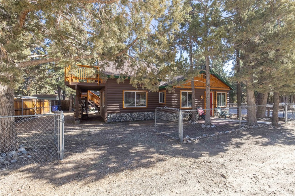 898 B Lane Big Bear City, CA 92314 - Photo 28 of 38 a front view of a house with a yard