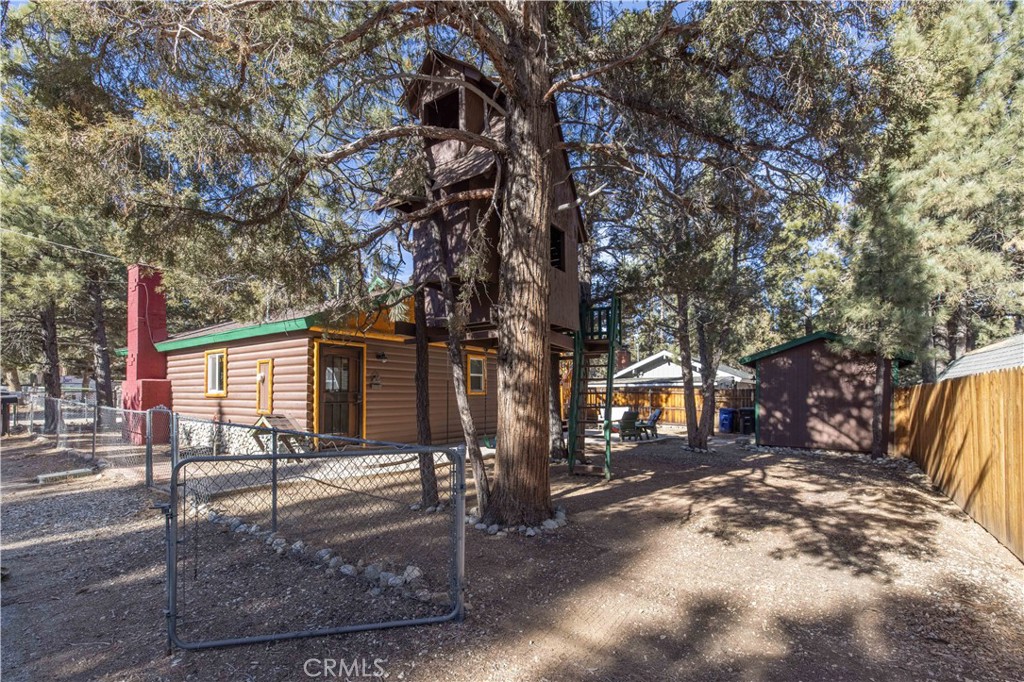 898 B Lane Big Bear City, CA 92314 - Photo 29 of 38 a view of a house with a tree