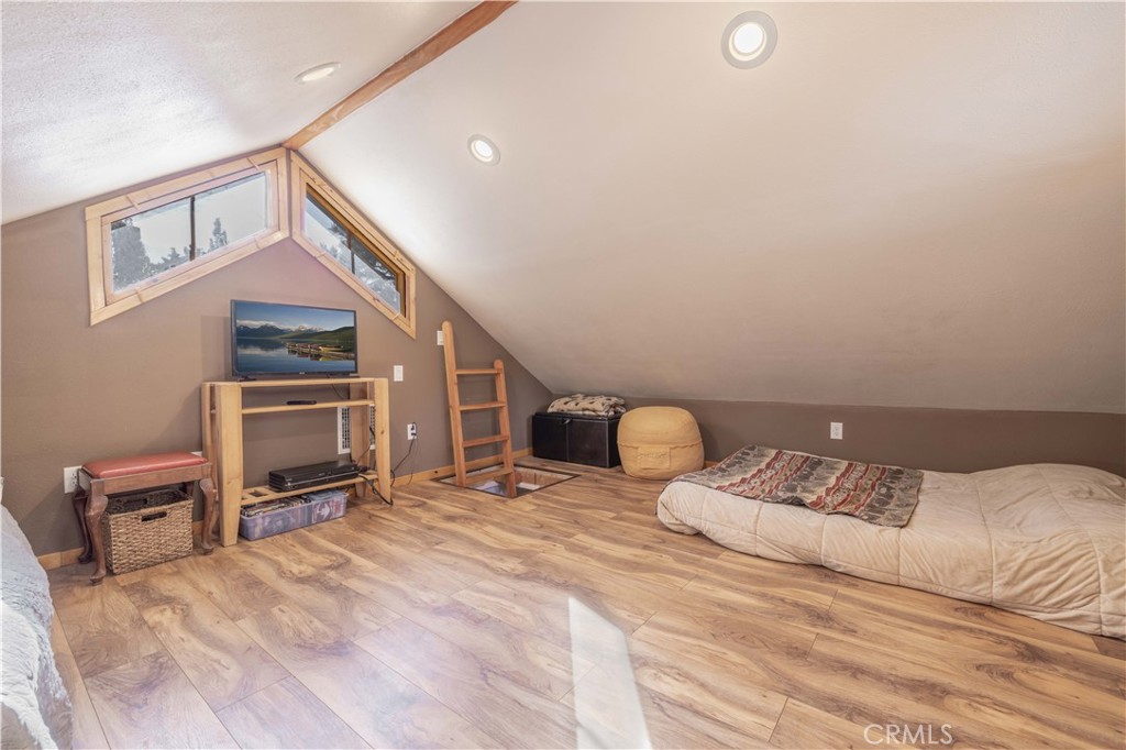 898 B Lane Big Bear City, CA 92314 - Photo 31 of 38 a bedroom with a bed and a tv