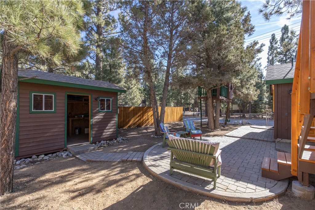 898 B Lane Big Bear City, CA 92314 - Photo 37 of 38 a view of a deck with chair and tables