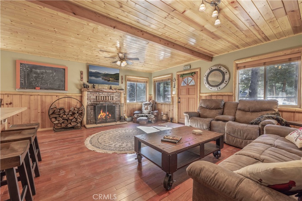898 B Lane Big Bear City, CA 92314 - Photo 6 of 38 a living room with furniture and a clock