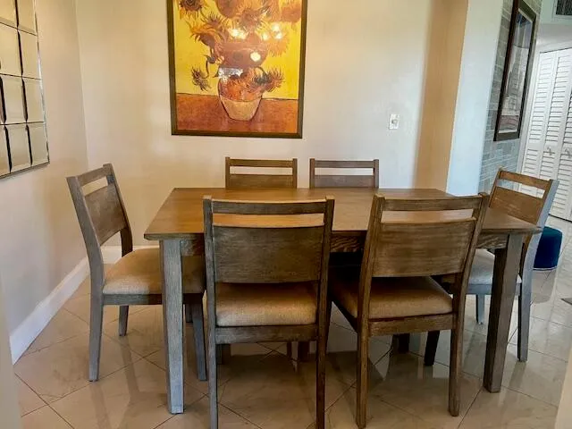 a living room with furniture and a lamp