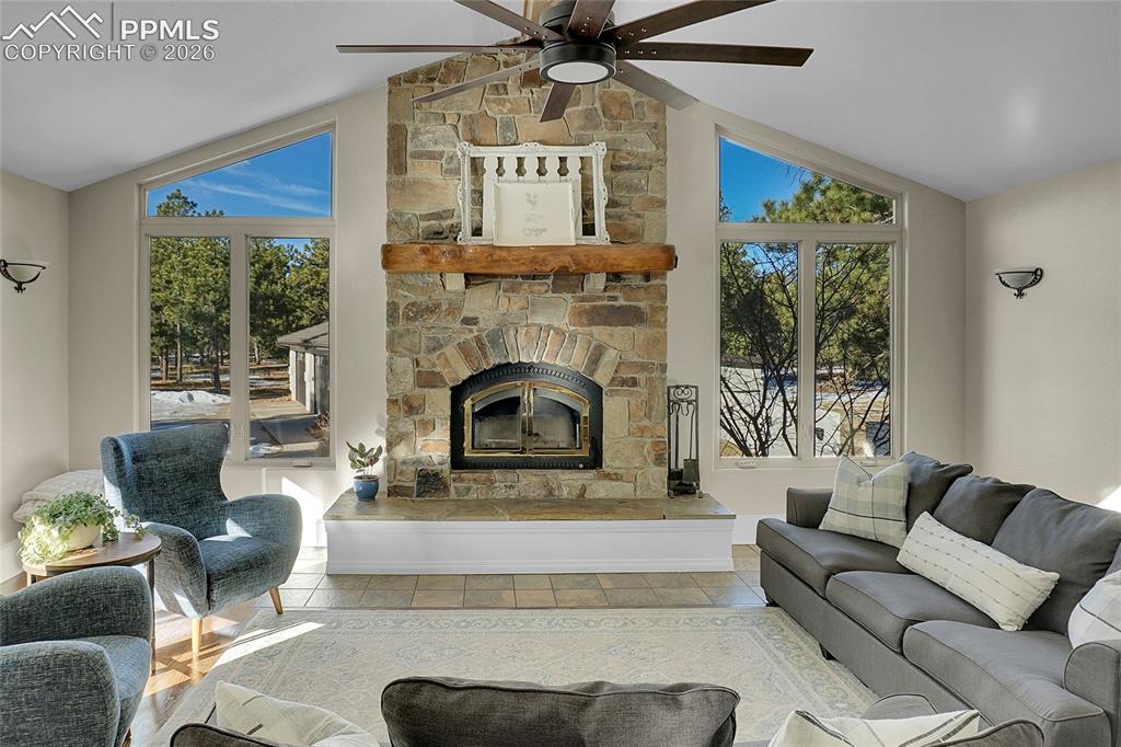 17350 Goshawk Road Colorado Springs, CO 80908 - Photo 9 of 50 a living room with furniture and a fireplace