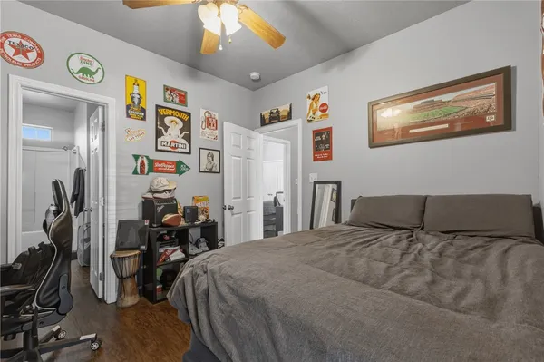 a bedroom with a bed and a view of bathroom