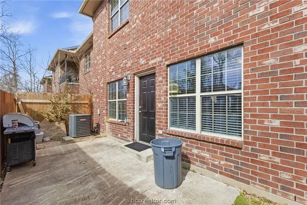 a front view of a house with large windows
