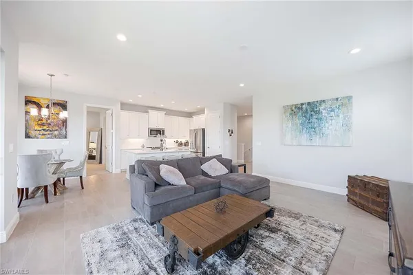 a living room with furniture and a rug