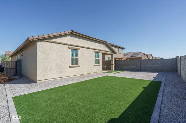 a view of a backyard of the house