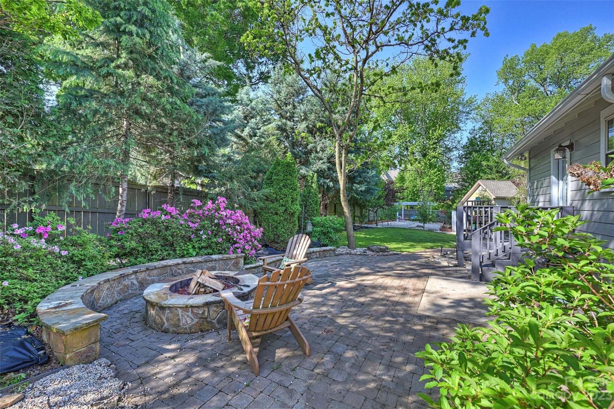 4206 Walker Road Charlotte, NC 28211 - Photo 31 of 40 a view of a table and chairs in back yard of the house