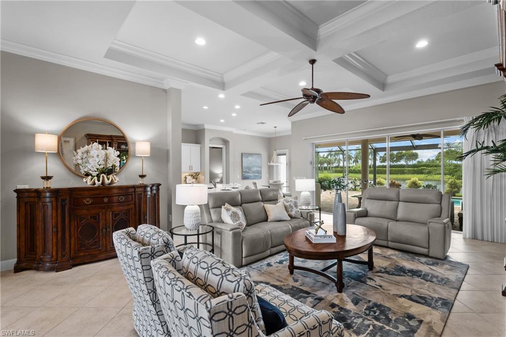9774 Nickel Ridge Circle Naples, FL 34120 - Photo 2 of 50 a living room with furniture and a large window