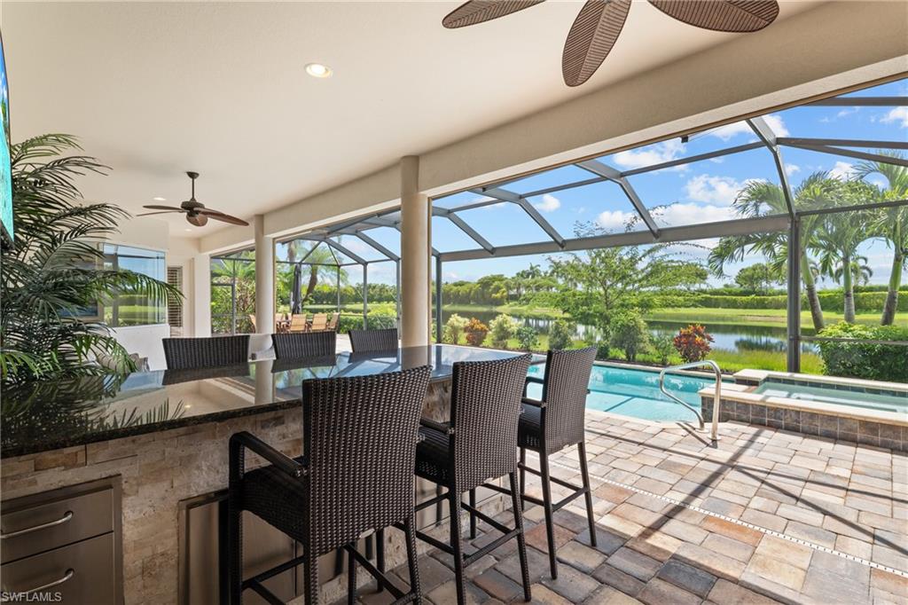 9774 Nickel Ridge Circle Naples, FL 34120 - Photo 29 of 50 a view of a dining room with furniture window and outside view