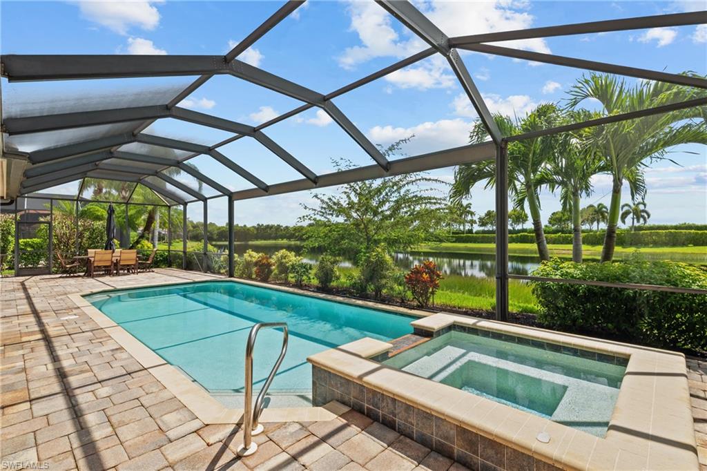 9774 Nickel Ridge Circle Naples, FL 34120 - Photo 30 of 50 a view of swimming pool with a yard