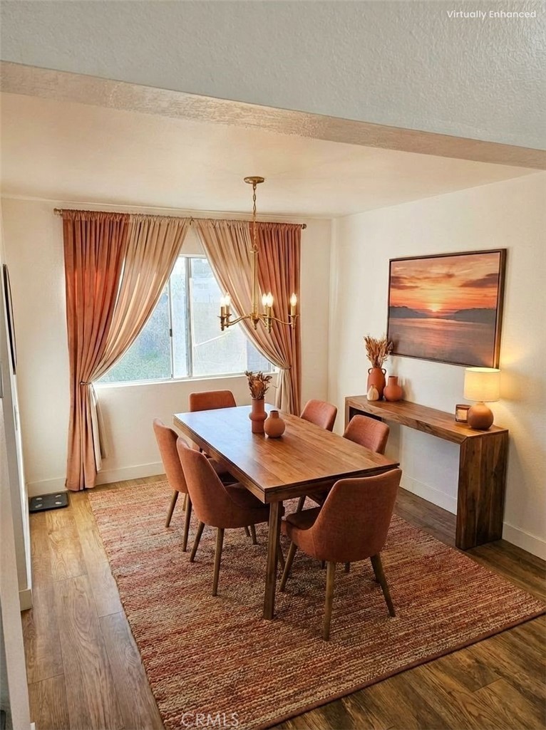 1376 Darwin Drive Oceanside, CA 92056 - Photo 12 of 22 a dining room with a wooden table and chairs