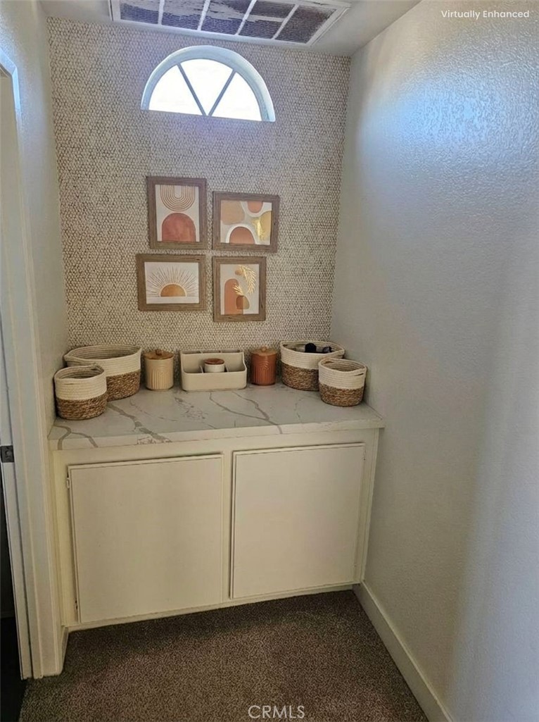 1376 Darwin Drive Oceanside, CA 92056 - Photo 21 of 22 a bathroom with a sink a mirror and a window