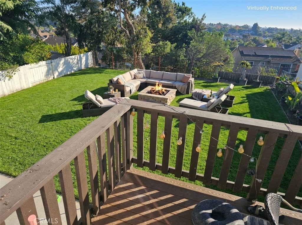 1376 Darwin Drive Oceanside, CA 92056 - Photo 3 of 22 a view of a wooden deck and a yard