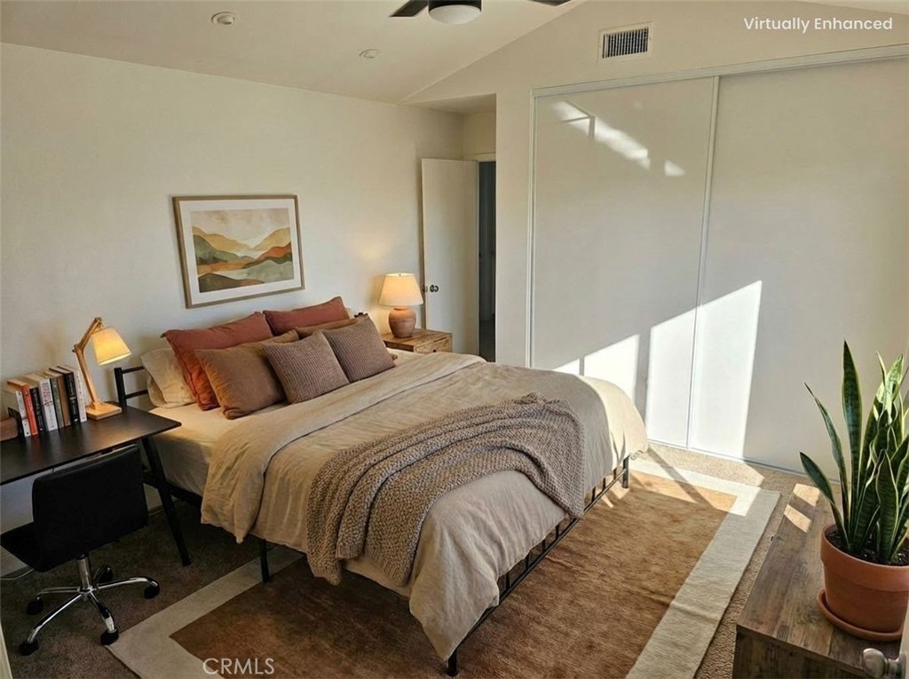 1376 Darwin Drive Oceanside, CA 92056 - Photo 7 of 22 a bedroom with bed and a potted plant