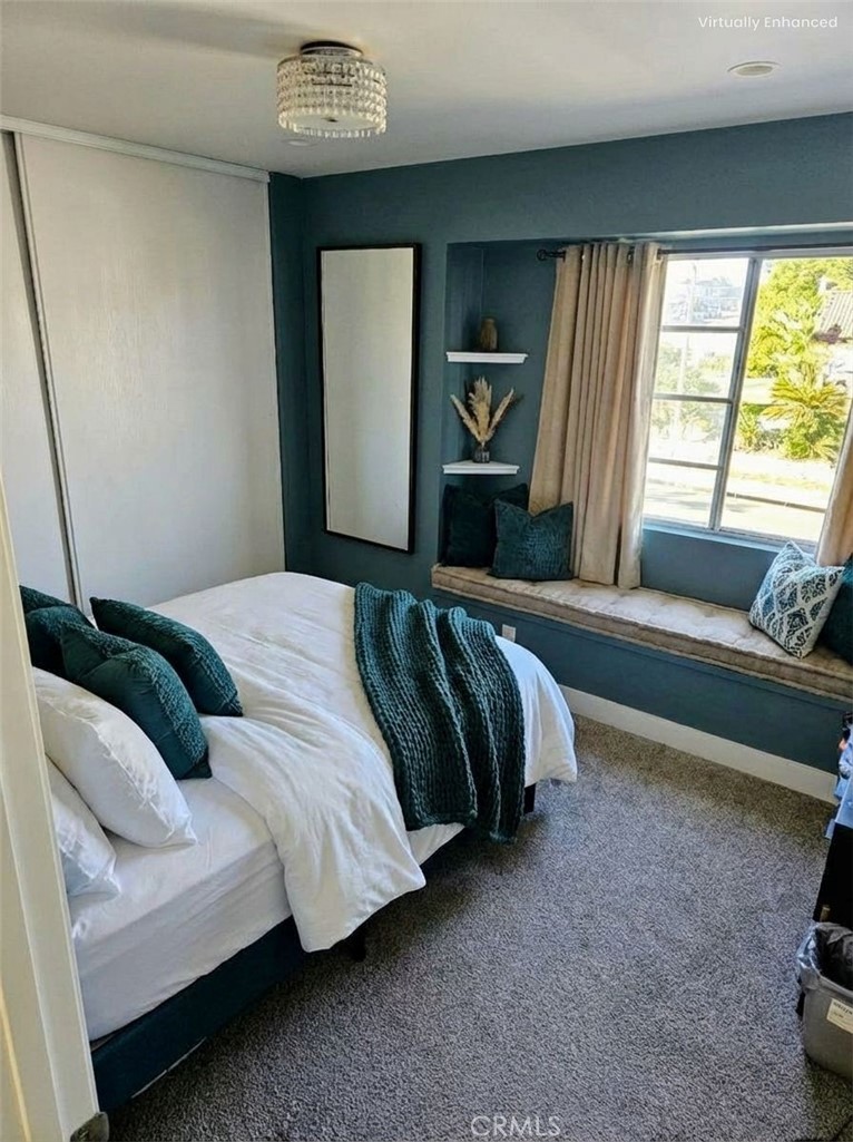 1376 Darwin Drive Oceanside, CA 92056 - Photo 10 of 22 a spacious bedroom with a bed and a window
