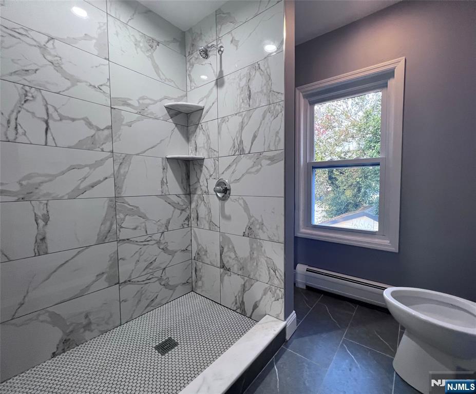 17 North Summit Street, Unit 2 Bergenfield, NJ 07621 - Photo 3 of 13 a bathroom with a shower and a toilet