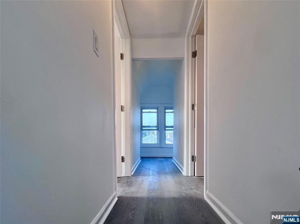 17 North Summit Street, Unit 2 Bergenfield, NJ 07621 - Photo 7 of 13 a view of a hallway with wooden floor