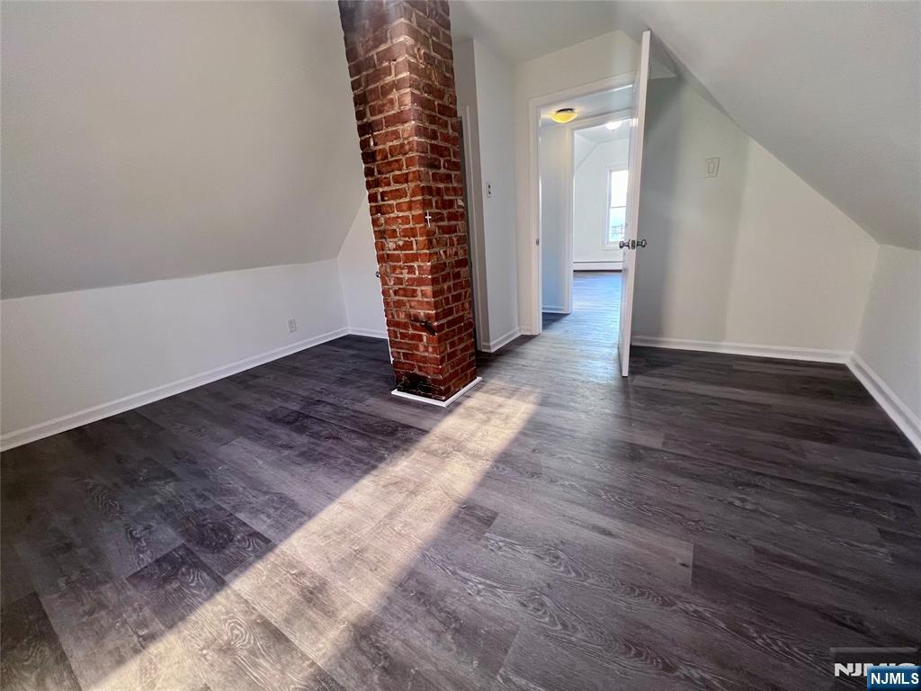 17 North Summit Street, Unit 2 Bergenfield, NJ 07621 - Photo 8 of 13 wooden floor in an empty room with a window