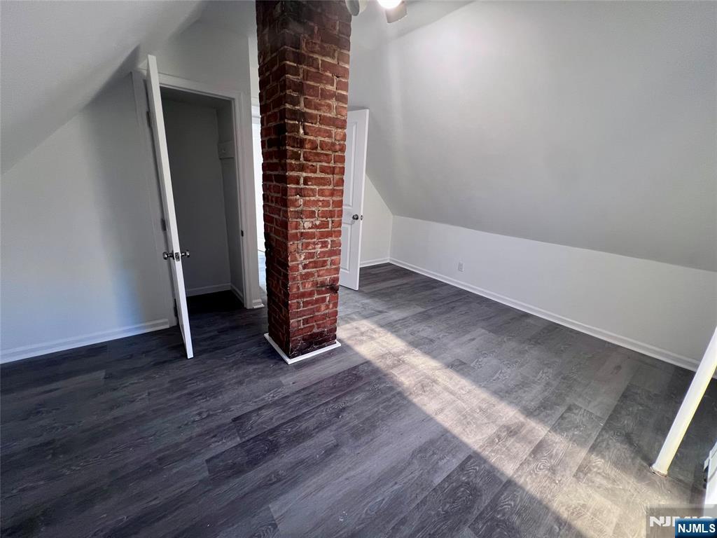 17 North Summit Street, Unit 2 Bergenfield, NJ 07621 - Photo 9 of 13 an empty room with wooden floor and windows