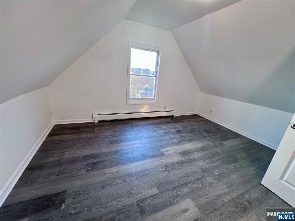 17 North Summit Street, Unit 2 Bergenfield, NJ 07621 - Photo 10 of 13 an empty room with wooden floor and windows