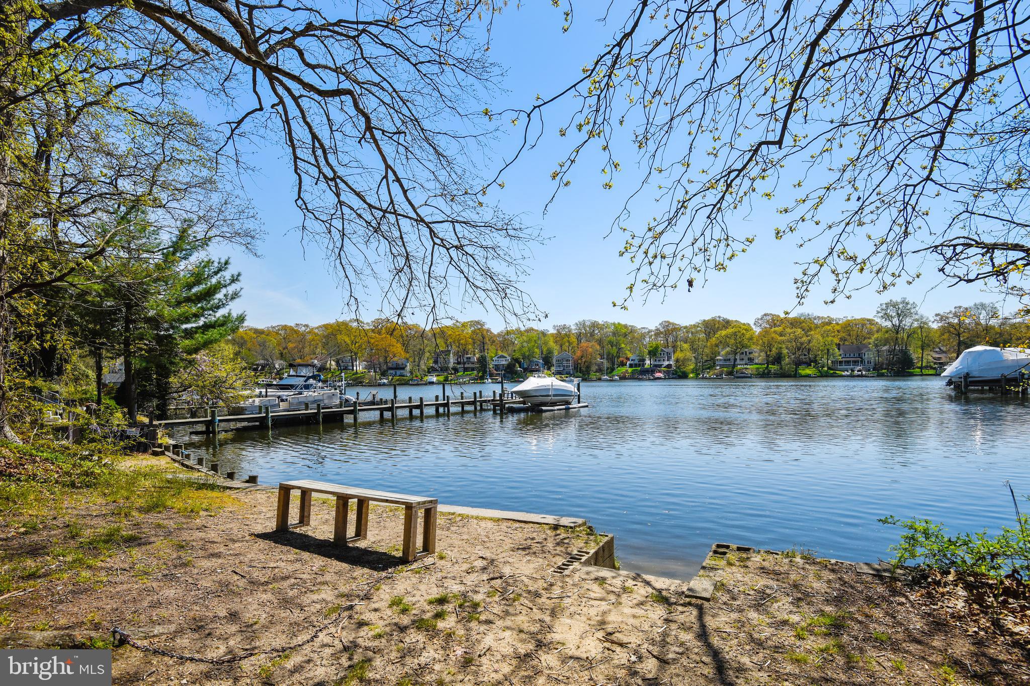 552 Sunset Knoll Road Pasadena, MD 21122 - Photo 35 of 36 a view of a lake with houses in the back
