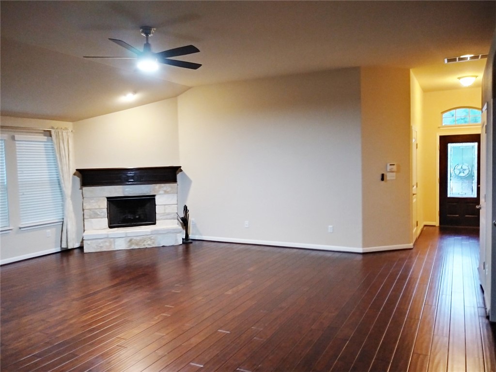 348 Stone View Trail Austin, TX 78737 - Photo 4 of 26 Big living room with gas fireplace and newly installed ceiling fan