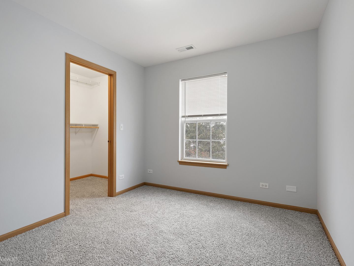 67 Colonial Court Streamwood, IL 60107 - Photo 12 of 25 an empty room with windows