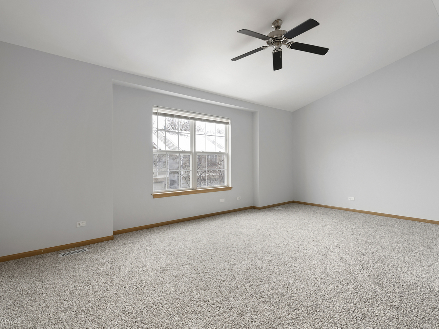 67 Colonial Court Streamwood, IL 60107 - Photo 17 of 25 an empty room with windows and fan