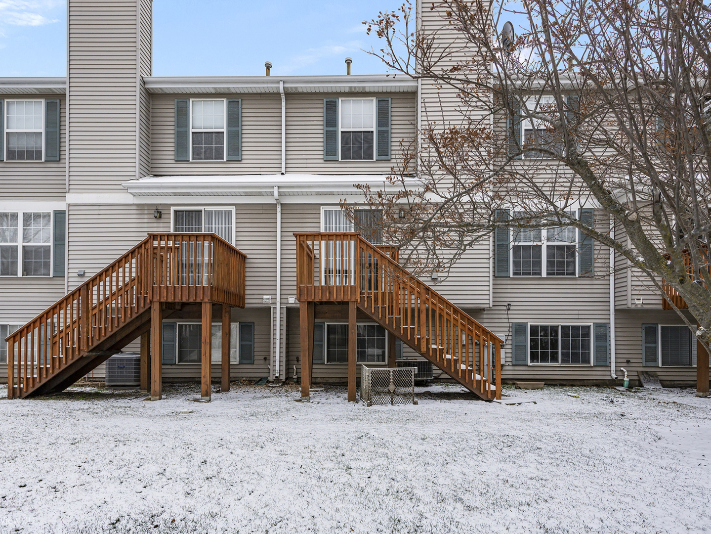 67 Colonial Court Streamwood, IL 60107 - Photo 21 of 25 a view of a house with a yard