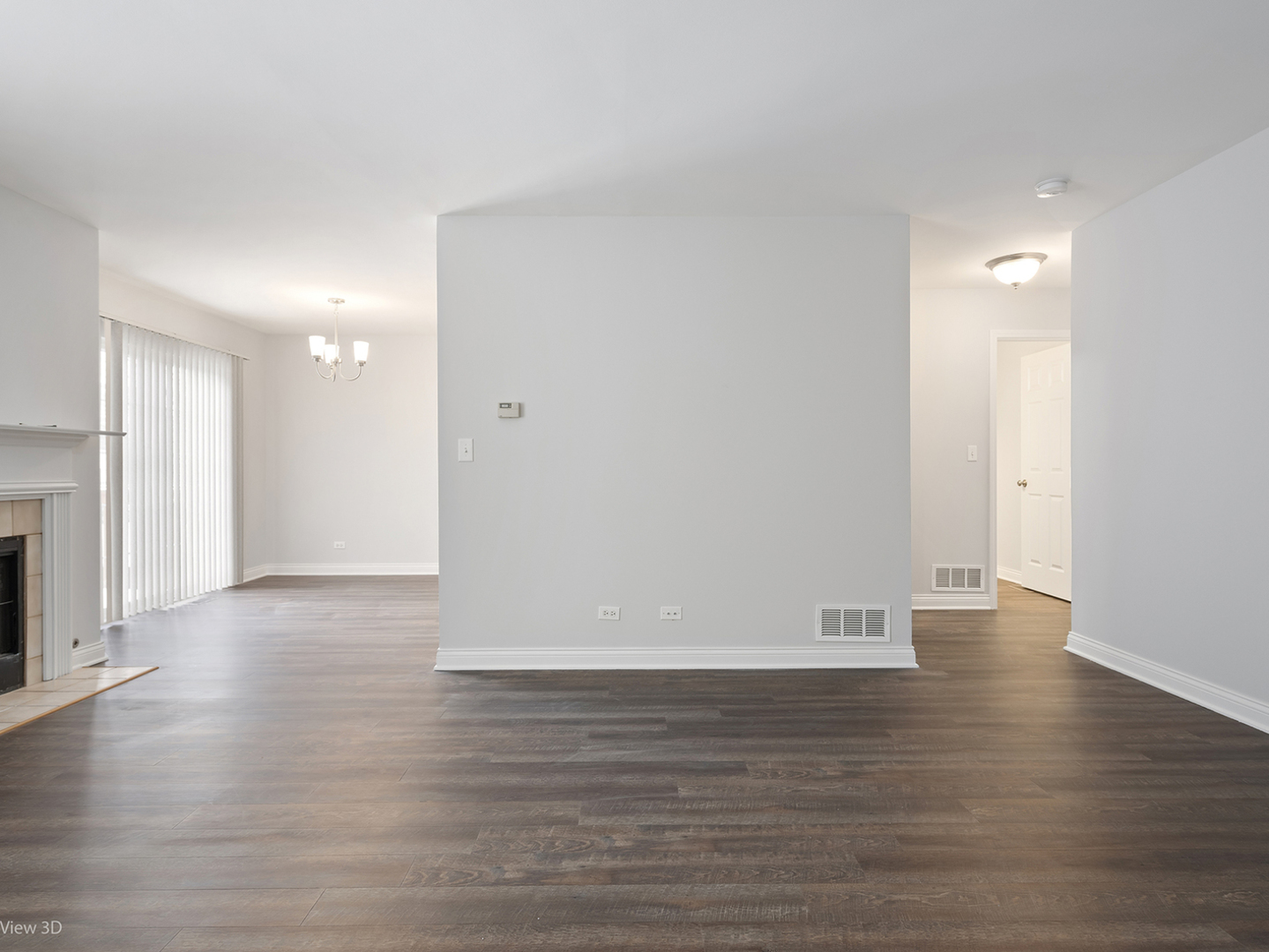 67 Colonial Court Streamwood, IL 60107 - Photo 3 of 25 a view of an empty room with wooden floor