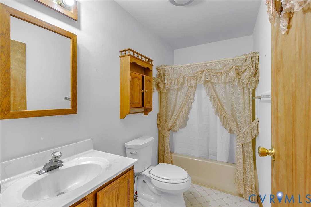 831 Fountain Gate Road Heathsville, VA 22473 - Photo 19 of 50 a bathroom with a sink toilet and shower