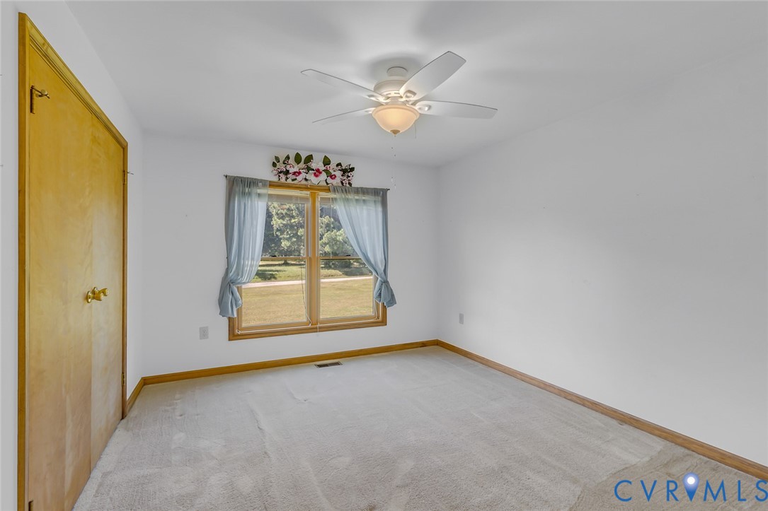 831 Fountain Gate Road Heathsville, VA 22473 - Photo 20 of 50 a view of an empty room with a window