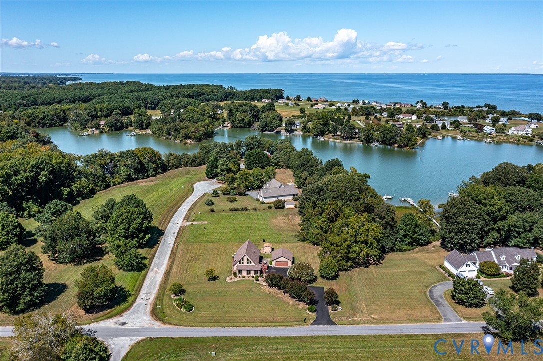 831 Fountain Gate Road Heathsville, VA 22473 - Photo 2 of 50 an aerial view of a house with a lake view