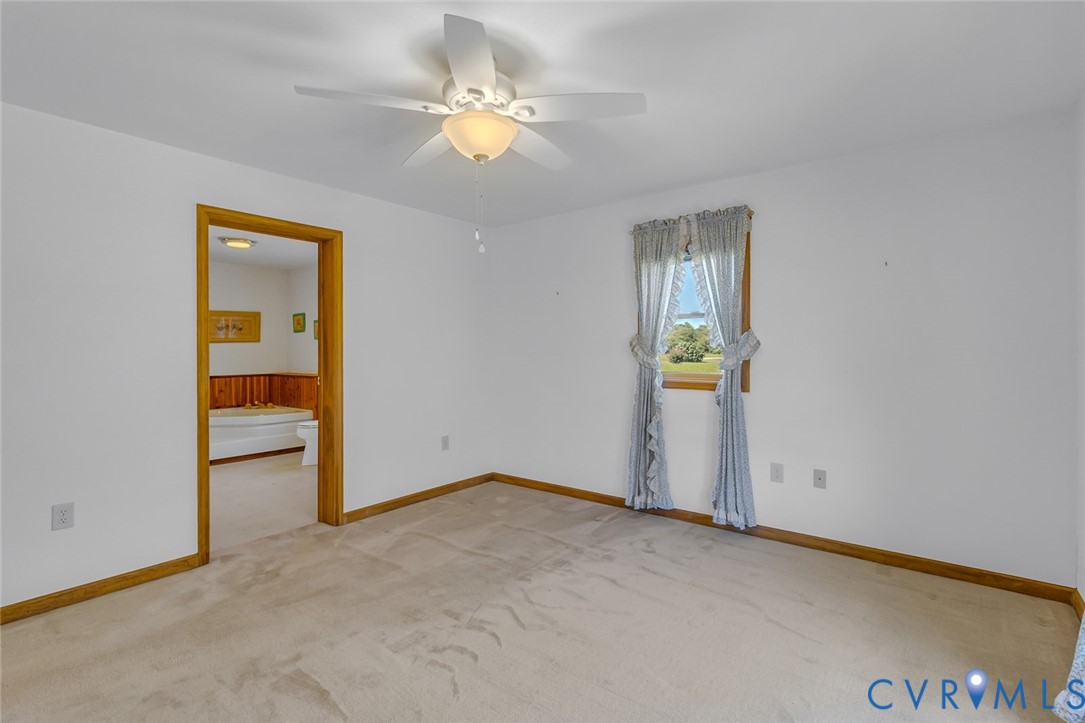 831 Fountain Gate Road Heathsville, VA 22473 - Photo 22 of 50 an empty room with closet and windows