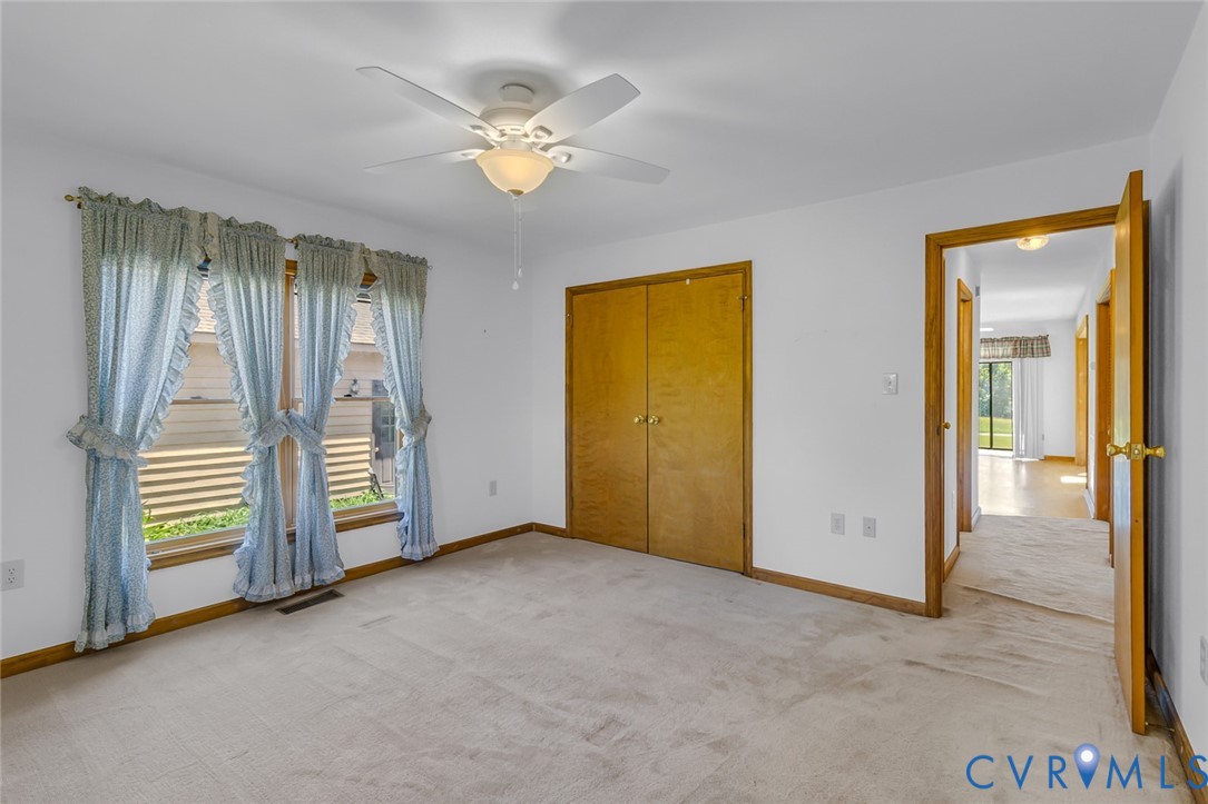 831 Fountain Gate Road Heathsville, VA 22473 - Photo 23 of 50 an empty room with closet and windows