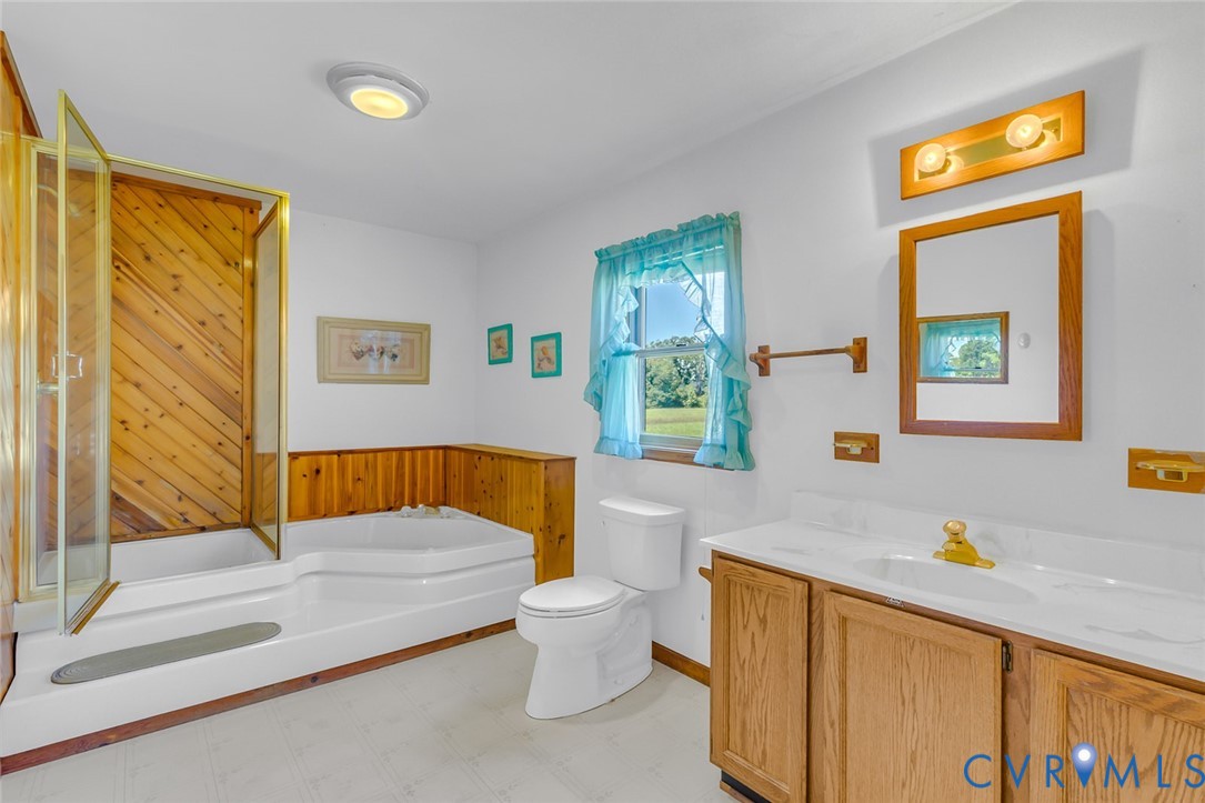 831 Fountain Gate Road Heathsville, VA 22473 - Photo 24 of 50 a bathroom with a sink and a bathtub